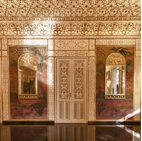 A wall of the Mirrors' Room with decorations depicting oriental landscapes