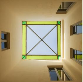 External loggia with polychrome glass ceiling
